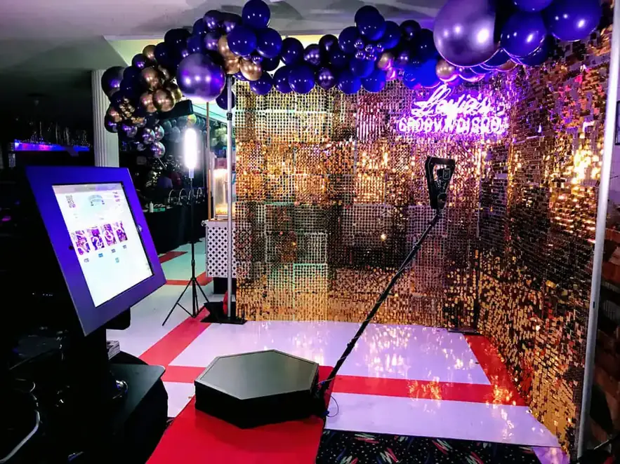 Gold sequin backdrop and 360 booth platform for a Goa celebration