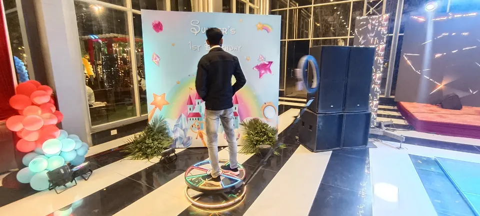 Guest standing on a 360 booth platform during a Goa celebration