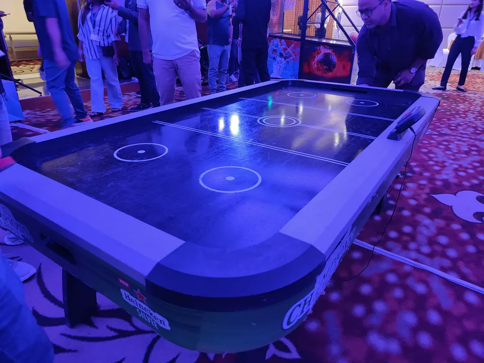 Black air hockey table for corporate guest engagement in Goa