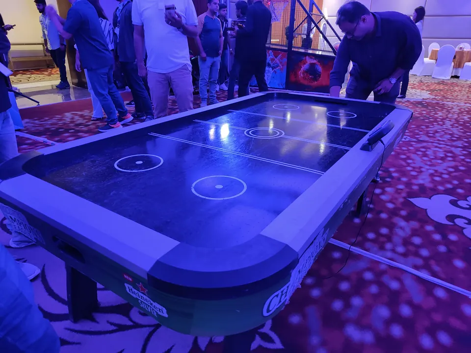 Premium black air hockey table placed at an indoor event in Goa