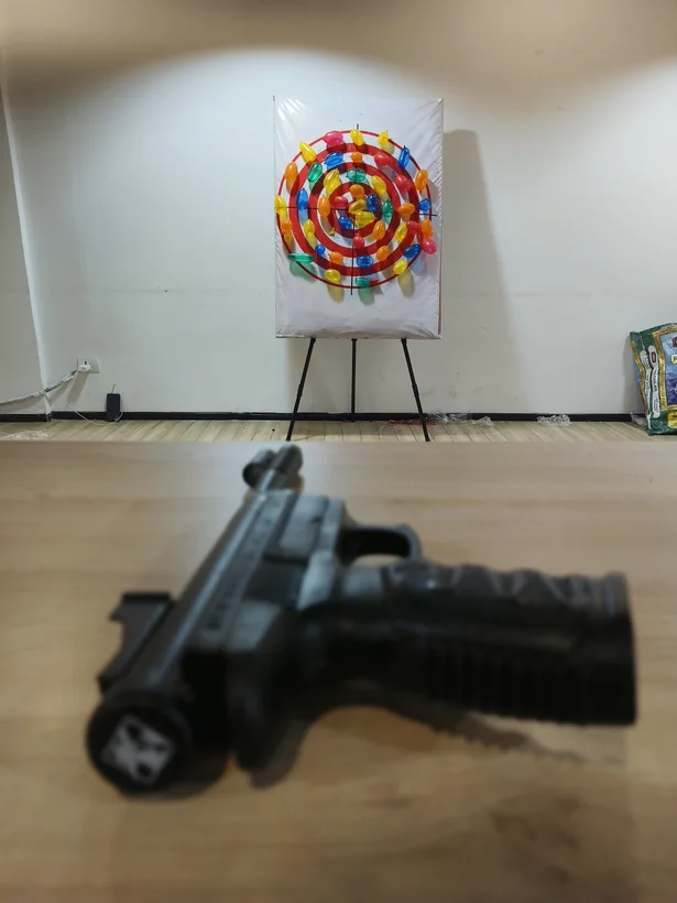 Indoor balloon shooting target board ready for guests in Goa