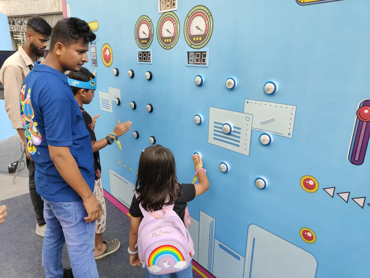 Children playing a Batak Pro reaction wall game at an event in Goa