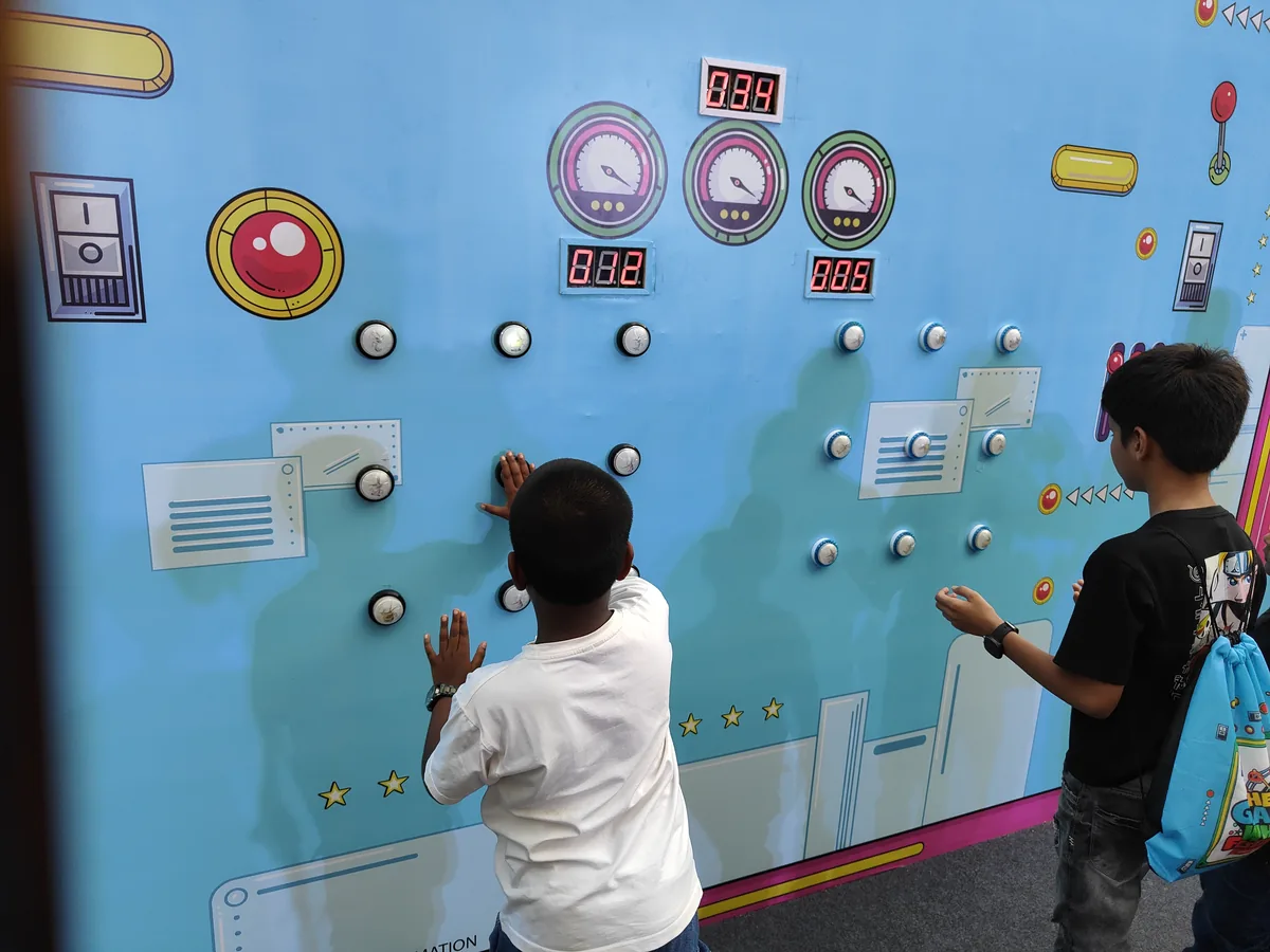 Two children using a Batak Pro reaction game during a Goa celebration