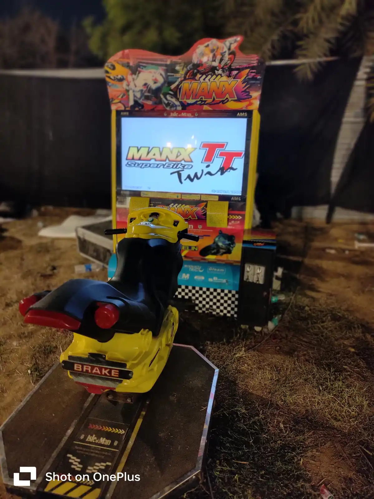 Front view of a bike racing arcade game station in Delhi