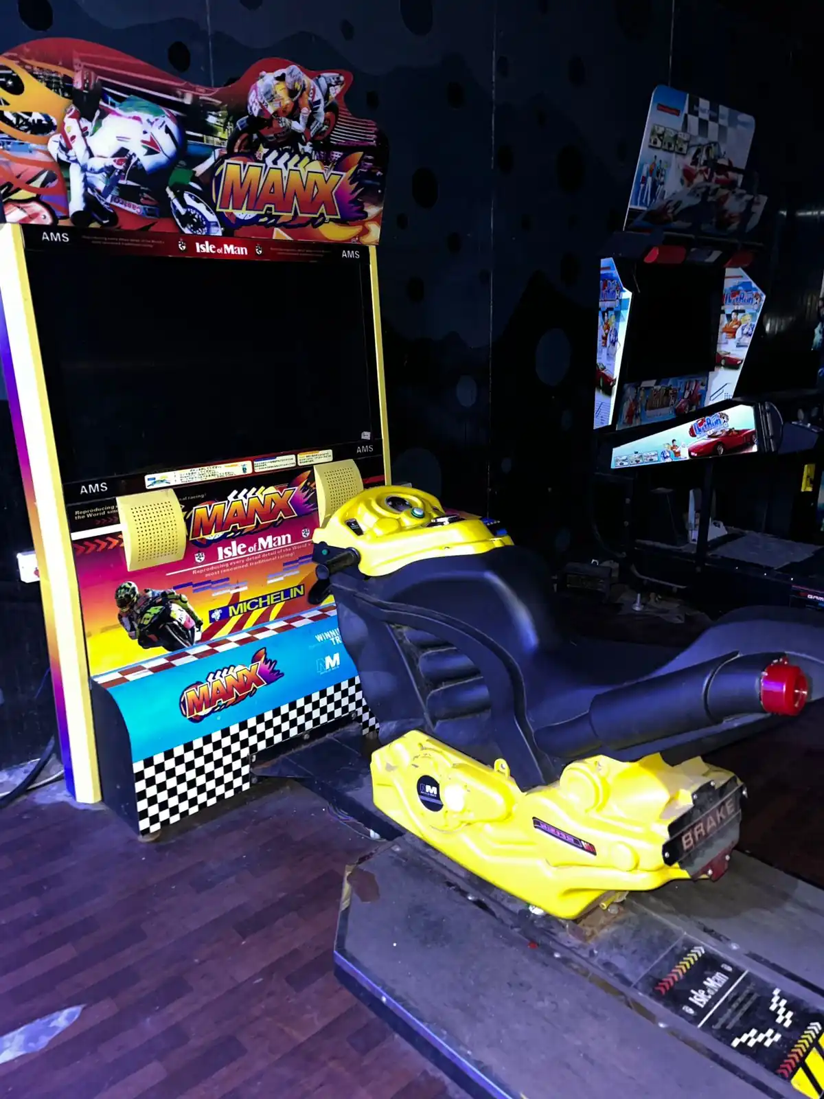 Side view of a bike racing arcade machine ready for guest play in Delhi