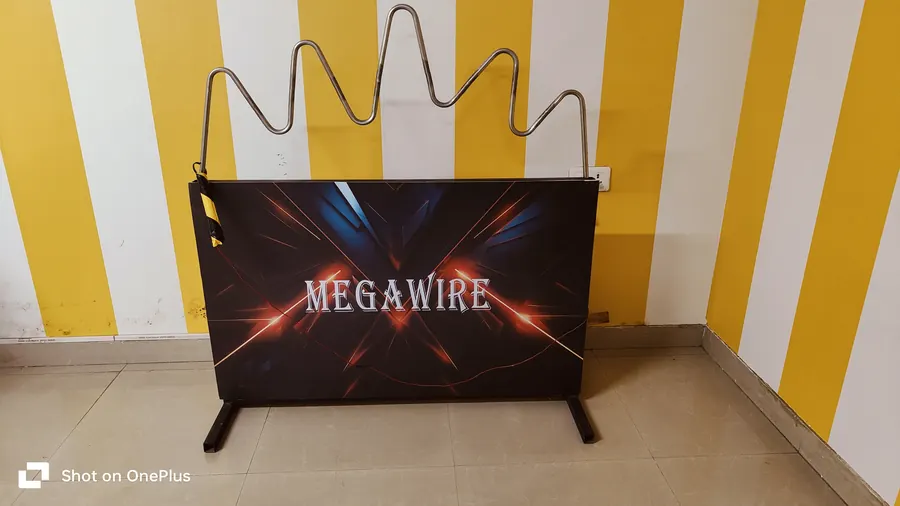 Guests enjoying buzz wire game during a Goa celebration