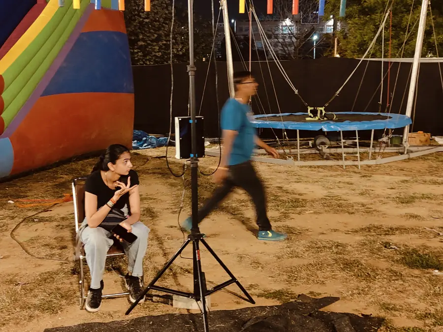 Guests enjoying catch the stick game during a Goa celebration