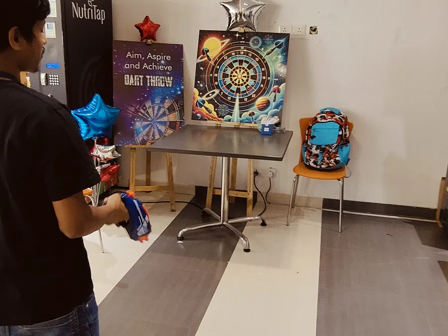 Guests enjoying dart game during a Mumbai celebration