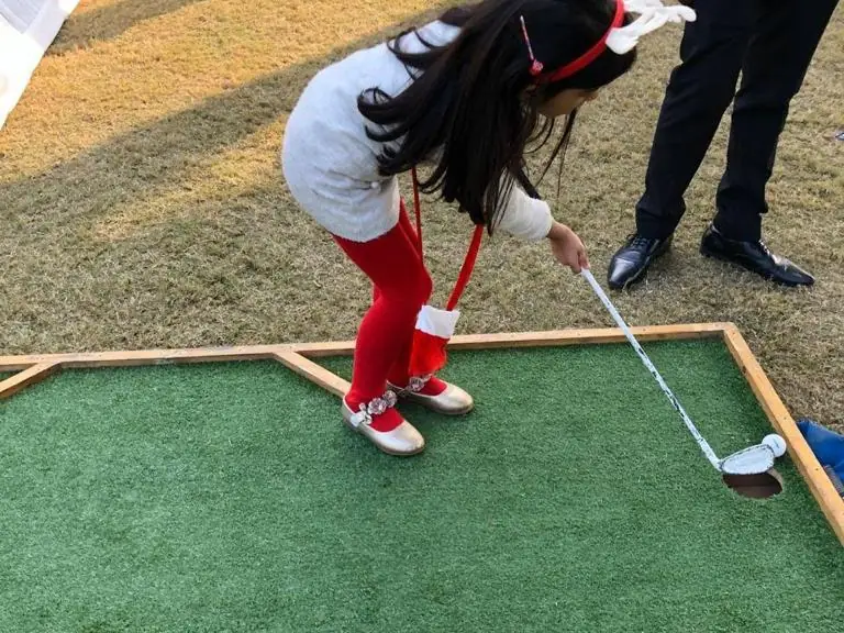 Guests enjoying mini golf game during a Goa celebration