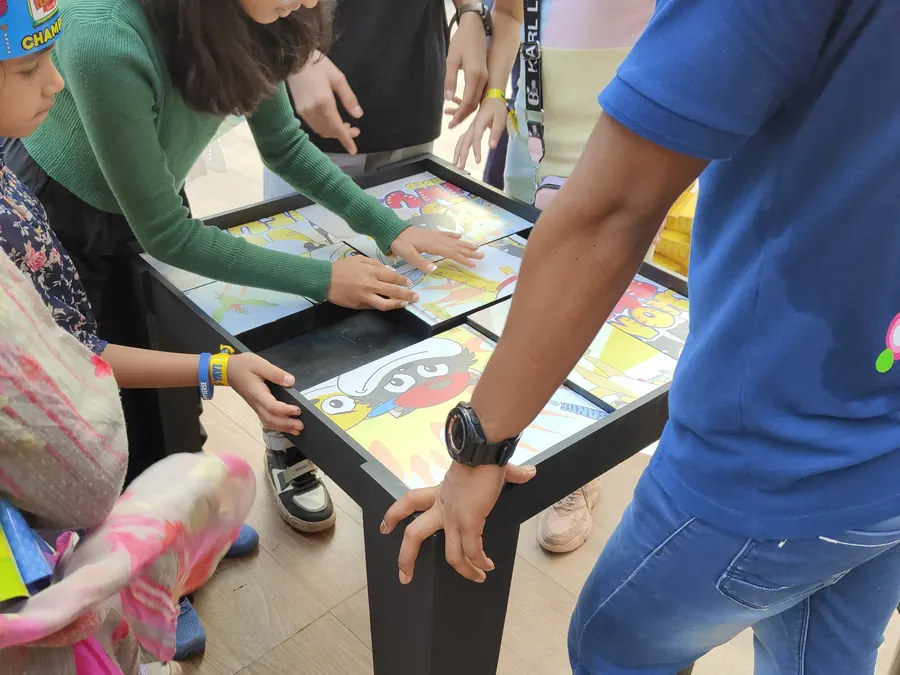 Guests enjoying puzzle game during a Goa celebration