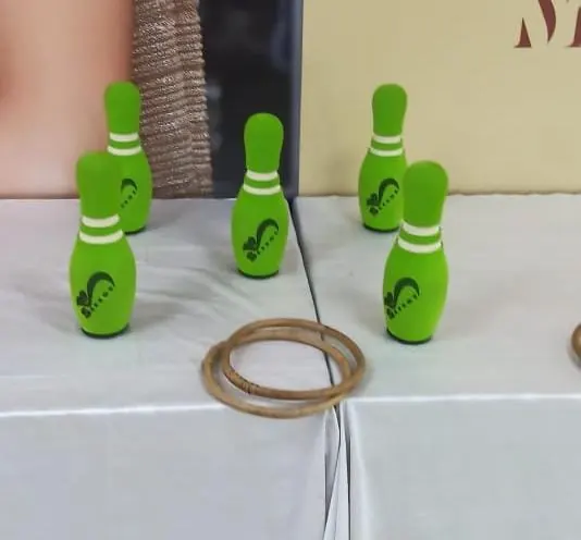 Guests enjoying ring toss game during a Goa celebration