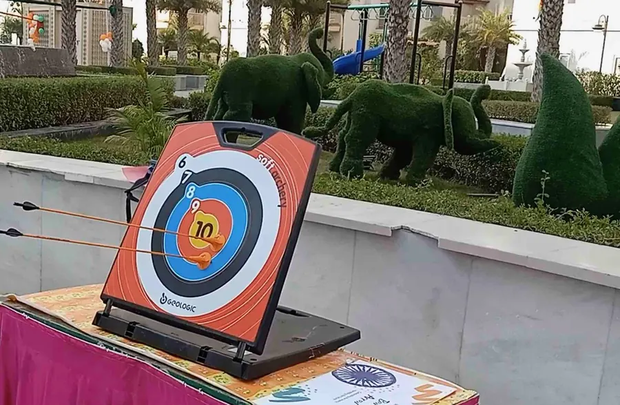 Guests enjoying soft archery game during a Kanpur celebration
