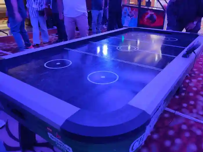 Air hockey table rental Gurgaon, Air hockey table hire, Rent air hockey table near me, Hire air hockey, Air hockey for parties, Event game rentals Gurgaon, Entertainment for events in Gurgaon